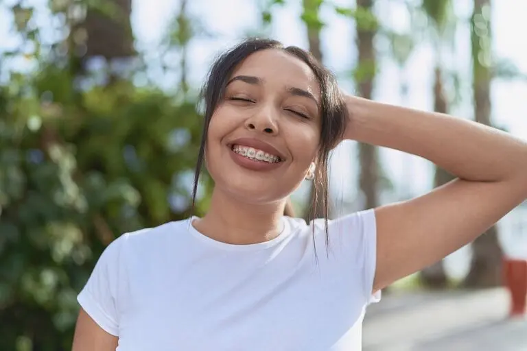young arab woman with metal braces breathing closed eyes street - Alternatives to Braces in St. Augustine, FL